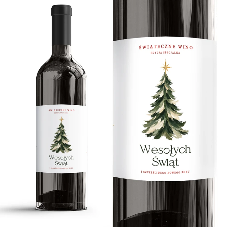 Biała etykieta samoprzylepna na butelce wina z malowaną choinką i napisem Świąteczne Wino Edycja Specjalna.