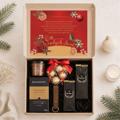 Box świąteczny z kawą Davidoff, herbatą, miodem i skórzanym brelokiem.
